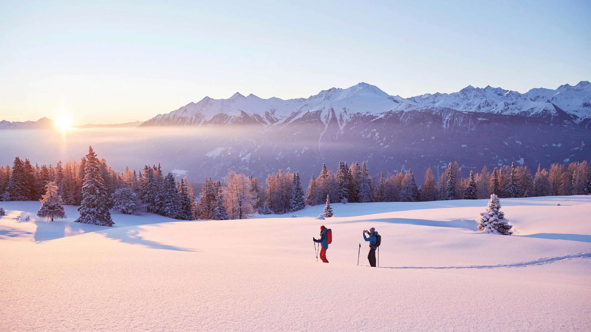 Couple skiing in snow, Schneeschuhwandern Simmering, Austria