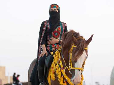 Woman Riding Horse, Saudi Arabia