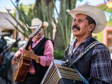 Man playing in Town Square, Mexico
