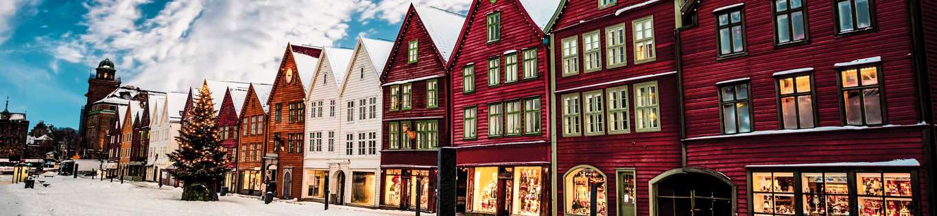 Famous Bryggen Street With Wooden Colored Houses In Bergen At Christmas, Norway