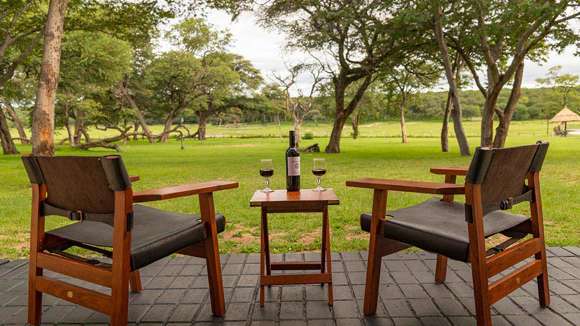 Hwange Safari Lodge, Hwange National Park, Zimbabwe, Exterior Table with wine