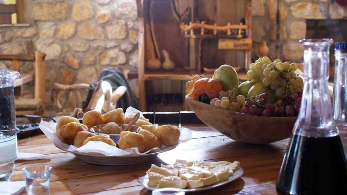 Table of food including cheese and grapes