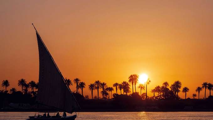 Nile at sunset with felucca boat in Egypt