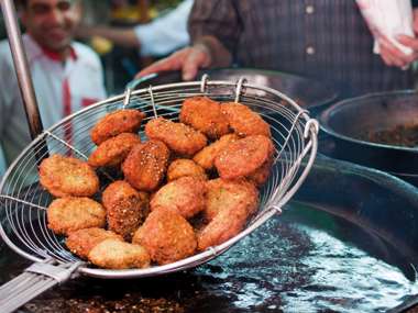 Falafel being lifted out of fryer in Egypt